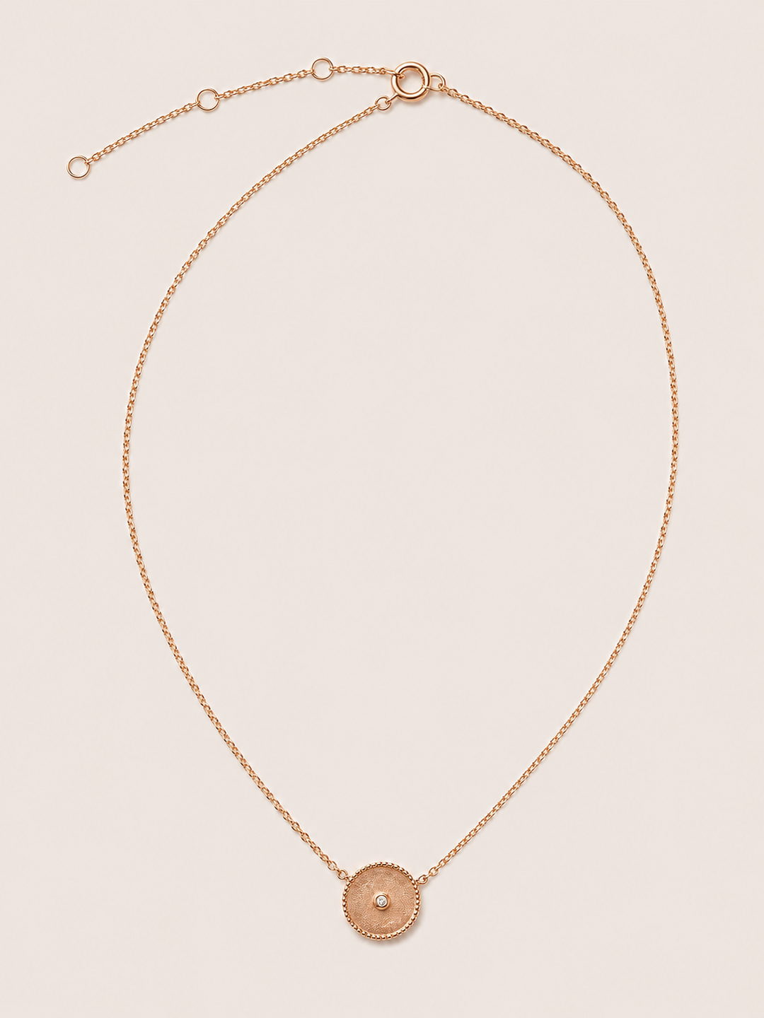 COLGANTE LA MONEDA